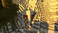 A barely exposed desert pyramid (Image via Mojang)